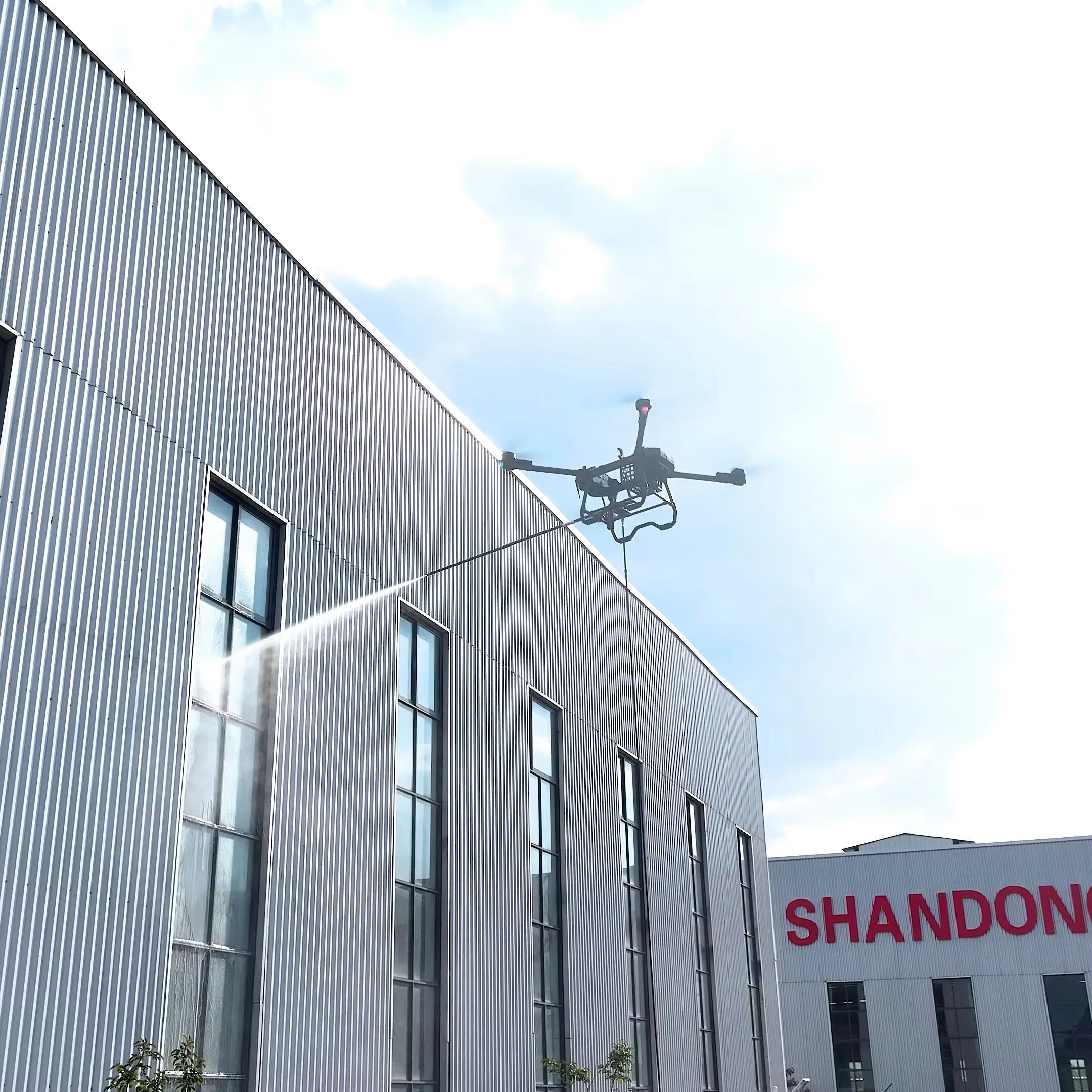 Outdoor Window Cleaning Drone with Water Hose Chemicals